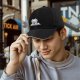 Black baseball cap with 'Dawn of the Arcade' and space invader graphic