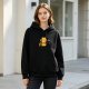 Black hoodie with grumpy orange cat holding a coffee mug