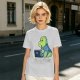Olive t-shirt with a cartoon dinosaur working on laptop holding coffee