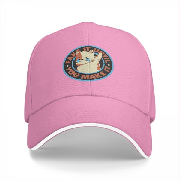 Black baseball cap with crying cat graphic and fake it until you make it text