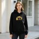 Black hoodie with two crows on branch against yellow semicircle graphic