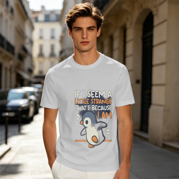 Olive t-shirt with 'If I seem a little strange that's because I am' penguin print