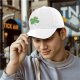 Black baseball cap with decorative four-leaf clover graphic