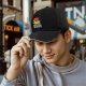 Black baseball cap with funny duck graphic and 'duck it all no regrets' text