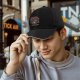Black baseball cap with cat remote movie graphic print