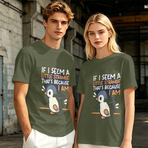 Olive t-shirt with 'If I seem a little strange that's because I am' penguin print