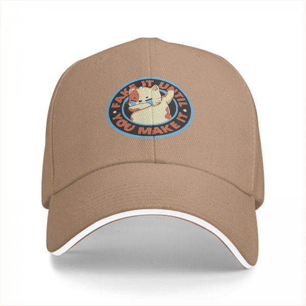 Black baseball cap with crying cat graphic and fake it until you make it text