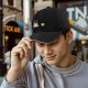 Black Baseball Cap with Coffee and Cookie Graphic Design