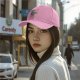 Black baseball cap with a relaxed axolotl graphic and 'RELAXOLOTL' text