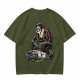 Olive T-shirt with Ghostface driving a Ghostbusters-style car graphic