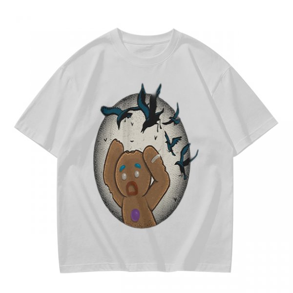 Olive T-shirt with a terrified gingerbread man and flying birds graphic
