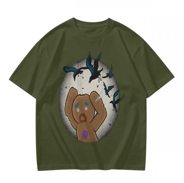 Olive T-shirt with a terrified gingerbread man and flying birds graphic