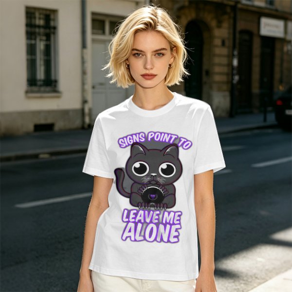 Olive t-shirt with a black cat holding a magic 8 ball and text 'Signs Point To Leave Me Alone'