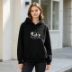 Black hoodie with Peanuts x Back to the Future crossover graphic
