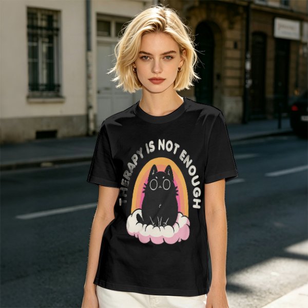 Olive graphic tee with black cat, rainbow, and 'Therapy Is Not Enough' text