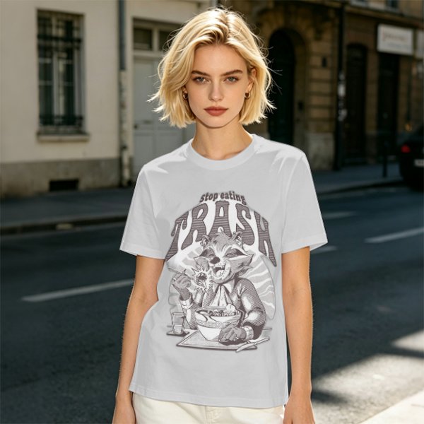 Olive graphic t-shirt with raccoon eating and 'Stop eating TRASH' print