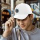 Black baseball cap featuring a cute dragon reading a red book