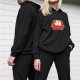 Black hoodie with cute ghosts sitting on red couch graphic