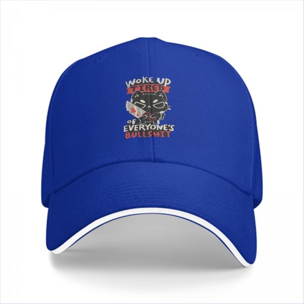 Black baseball cap with a tired cat graphic and humorous text