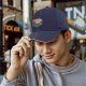 Black baseball cap with forest spirit creature graphic print