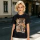 Olive green anime graphic t-shirt with monster and city scene