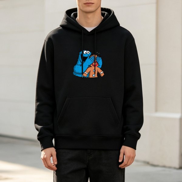 Black hoodie with Cookie Monster covering gingerbread man’s eyes graphic