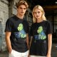 Olive t-shirt with a cartoon dinosaur working on laptop holding coffee