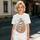 Olive green sloth t-shirt with 'Busy Doing' coffee graphic