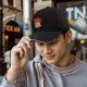 Black baseball cap with capybara eating ramen ramen club print