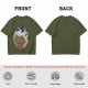 Olive T-shirt with a terrified gingerbread man and flying birds graphic