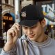 Black baseball cap with ninja cat eating ramen graphic