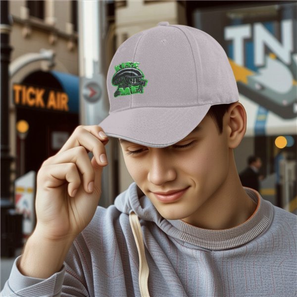 Black baseball cap with alien graphic and 'Kiss Me' text