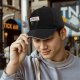 Black baseball cap with 'It Probably Can Get Worse' graphic print