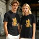 Olive T-shirt with mischievous orange cat knocking over green cup print