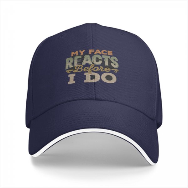 Black baseball cap with 'My Face Reacts Before I Do' printed design