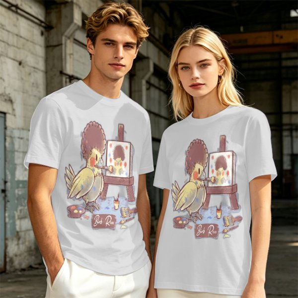 Olive T-Shirt Featuring a Bird Painting a Self-Portrait with an Afro