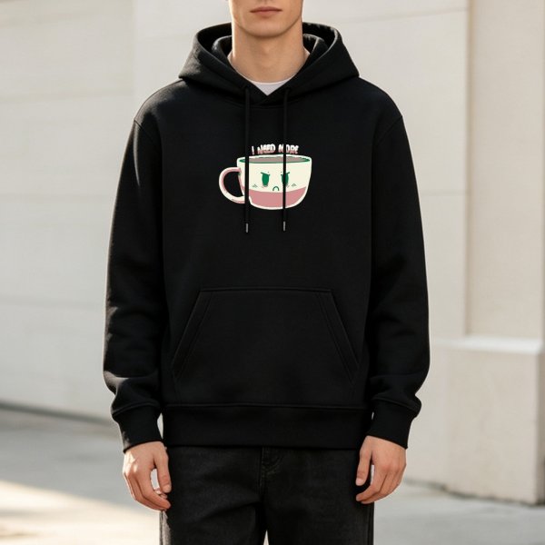 Black hoodie with angry coffee cup graphic and 'I NEED MORE' text