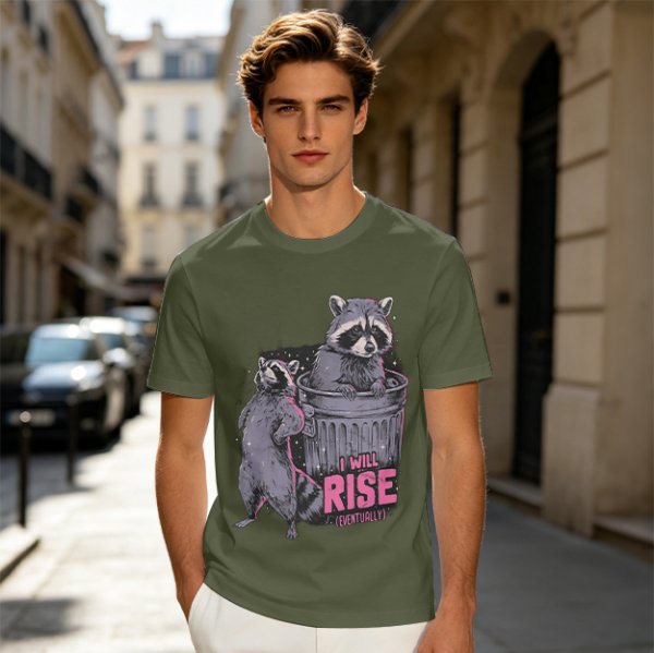 Olive graphic t-shirt with raccoons and 'I Will Rise Eventually' text
