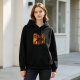 Black hoodie with four-panel illustrated character graphic