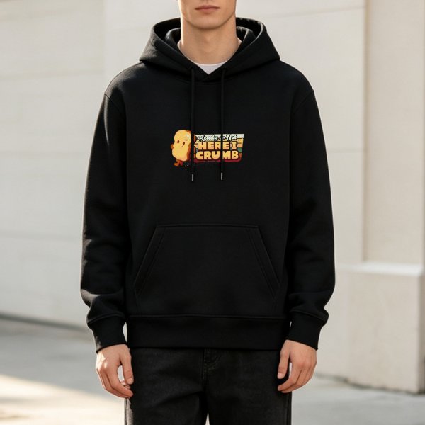 Black hoodie with cute bread character and Here I Crumb graphic