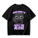 Olive t-shirt with a black cat holding a magic 8 ball and text 'Signs Point To Leave Me Alone'