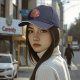 Black baseball cap with 'Support Your Local Lion' cat graphic