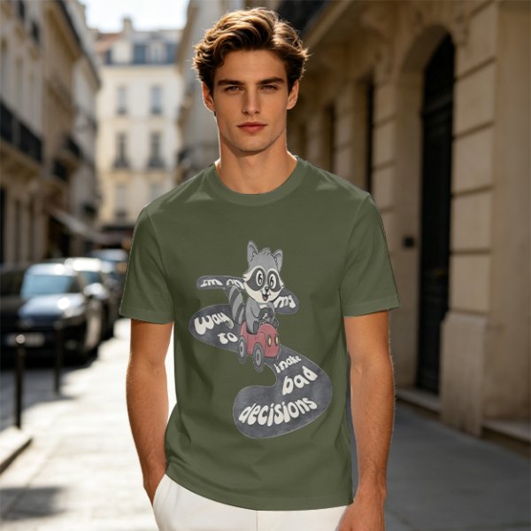 Olive graphic tee with raccoon driving car and 'Way to make bad decisions' text