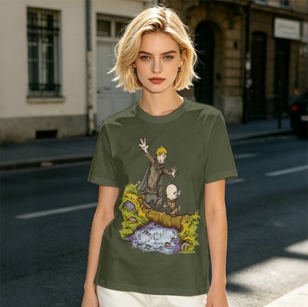 Olive T-shirt with fantasy characters balancing on a log over a stream