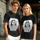 Olive green graphic t-shirt with bedridden cartoon girl and 'DAILY' text