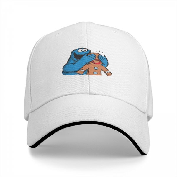Black baseball cap with Cookie Monster covering a gingerbread man’s eyes