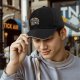 Black baseball cap with raccoons in trash graphic design