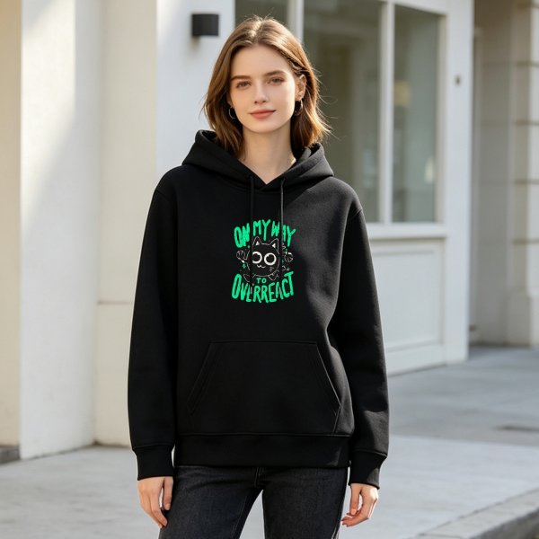 Black hoodie with 'On My Way To Overreact' cat graphic