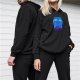 Black hoodie with blue Cheshire cat and silhouetted figures graphic