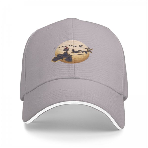 Black baseball cap with witch on broom silhouette against moon and birds